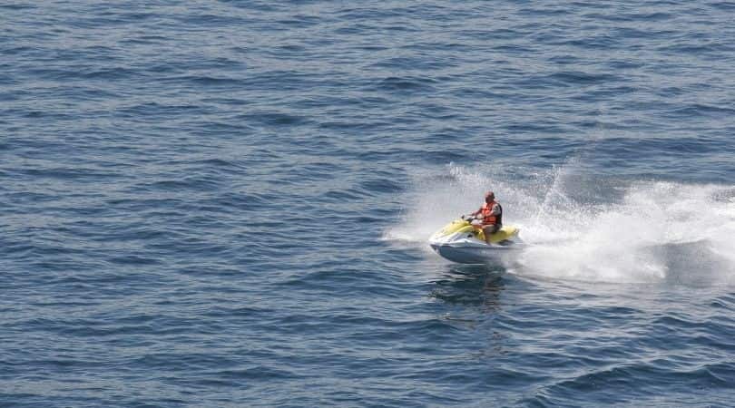 jet skiing - om beach